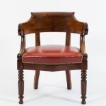 A Victorian mahogany tub-shaped library armchair:,