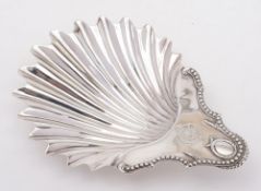 A George III silver dish, maker's mark worn, London, 1776: crested, of shell-shaped outline,