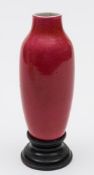 A Chinese peach bloom glazed vase: of slender baluster form, probably 18th century,