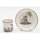 A Guérhard & Dihl (Paris) porcelain coffee can and saucer: painted en grisaille with a young