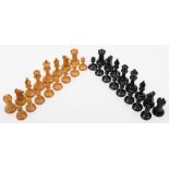 A boxwood Staunton pattern chess set: one side left natural, the other side ebonised,