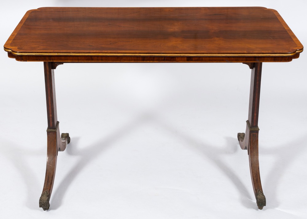 A Regency rosewood and satinwood crossbanded library table in the manner of Gillows:,