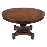 A Regency mahogany and brass inlaid circular dining table:,