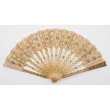 A 19th century sequin applied and gilt decorated fan: the silk and perforated leaf with painted