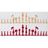 A 19th century English ivory Barleycorn style chess set: one side left natural the other side