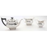 A George V silver three-piece tea service,  maker Joseph Ridge, Sheffield, 1927/28: crested,