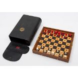 A Jaques 'Status Quo' bone travelling chess set: one side stained red, the other side left natural,