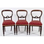 A set of six Victorian carved rosewood dining chairs:,