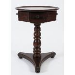 An early 19th Century mahogany and stained pine drum top circular occasional table:,