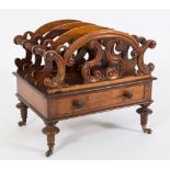 A Victorian carved rosewood three-division canterbury:,