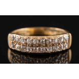 A gold and diamond two row ring: set with old-cut diamonds, approximately 0.