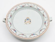 A Chinese armorial porcelain warming dish: of circular form with short handle and spout,