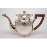 A Continental silver teapot: of ovoid form, the lift-off lid with acorn style finial,