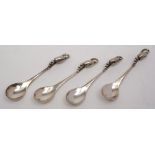 A set of four Georg Jensen 'Blossom' pattern salt spoons: stamped marks, 9cm. long, 1.26ozs.