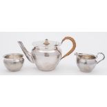 A George V silver three-piece tea service, maker Keswick School of Industrial Art, Chester,