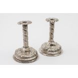 A pair of Continental silver candlesticks, maker SR below a crown,