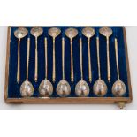 A set of twelve Imperial Russian silver gilt and niello inlaid spoons, maker CAC,