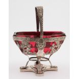 A 19th century German silver swing-handled basket: of rectangular outline with canted corners,