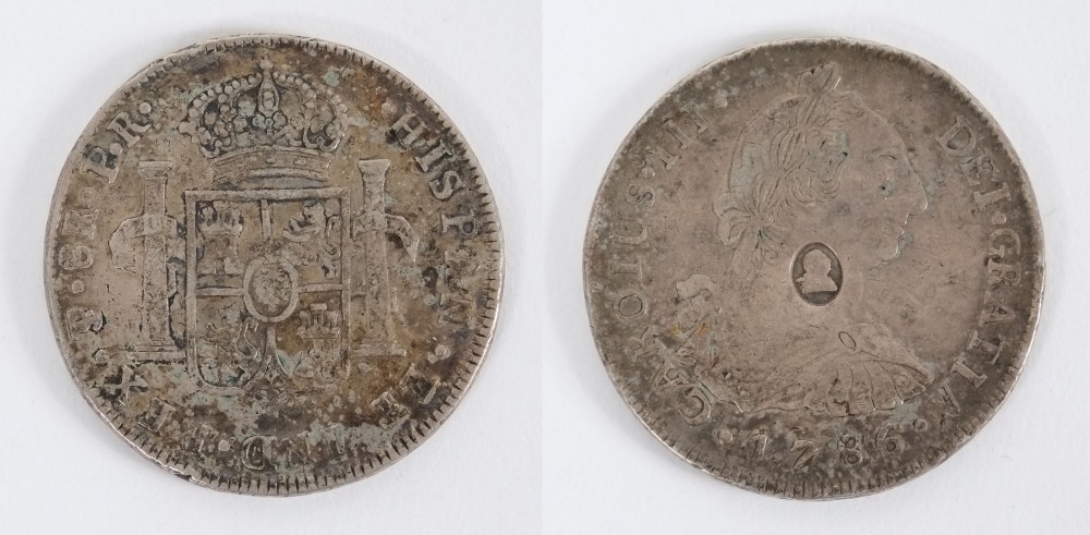 A Charles III silver eight reales/dollar: counter marked with head of George III in oval,
