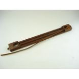 A mahogany two division game carrier with leather strap:, 61cm long.
