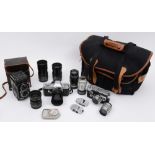 A Leica M3 SLR camera together with a collection of lenses and accessories in a Billingham case:,