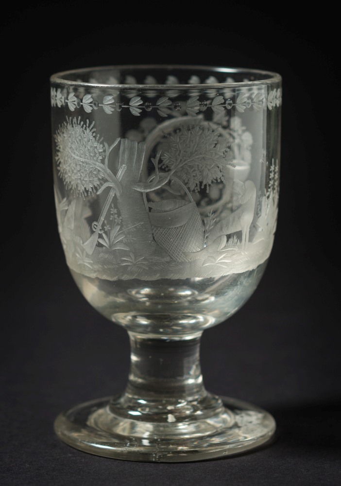 A 19th century pedestal glass goblet engraved with a hunting scene:,