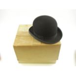 A black felt bowler hat and a black felt Homburg by Herbert Johnson, London, both size 7 in boxes:.