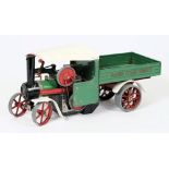 A Mamod live steam wagon: with green, white and red coachwork.