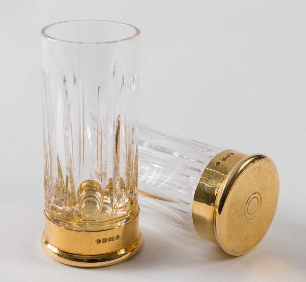 A pair of silver gilt mounted shot gun cartridge glasses by Asprey, London:,