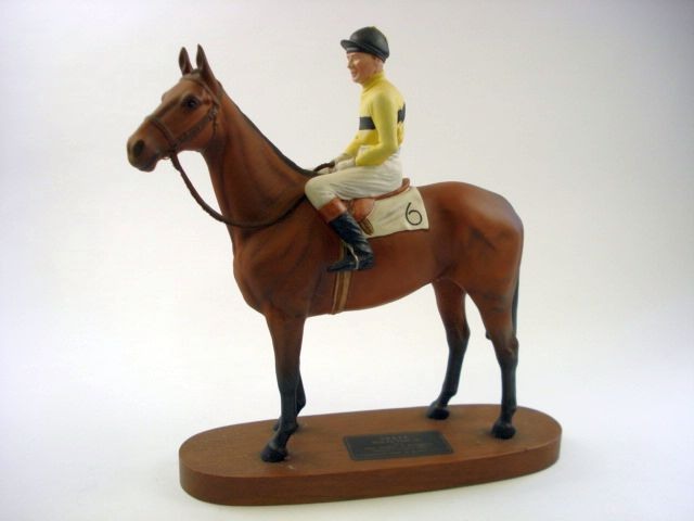 A Beswick Connoisseur model of 'Arkle':, on an oval mahogany base, 32cm high,