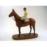 A Beswick Connoisseur model of 'Arkle':, on an oval mahogany base, 32cm high,