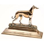 A brass doorstop in the form of a greyhound on downswept base:, 23cm high.