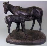 After Hap Krodmb, a Russian cast iron group of mare and foal: mounted on a naturalistic base, 37cm.