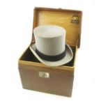 A grey top hat by Lincoln Bennett, size 7 1/4 in a brown leather hat box:.