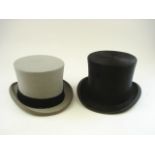 A black felt top hat by Herbert Johnson, London, together with a grey top hat by Moss Bros:,