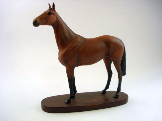 A Beswick Connoisseur model of ' Arkle with Pat Taffe Up':, on an oval mahogany base with plaque,