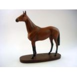 A Beswick Connoisseur model of ' Arkle with Pat Taffe Up':, on an oval mahogany base with plaque,