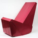 A 1970's red cardboard designer chair:, possibly to a design by Peter Raacke.