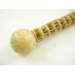 A fish vertebrae and marine ivory walking cane:,