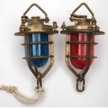 A pair of Admiralty pattern ships lamps: with red and green shades in a triple bar frame and