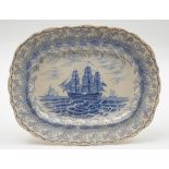 A 19th century Staffordshire blue and white meat plate with transfer decoration of a man-o-war