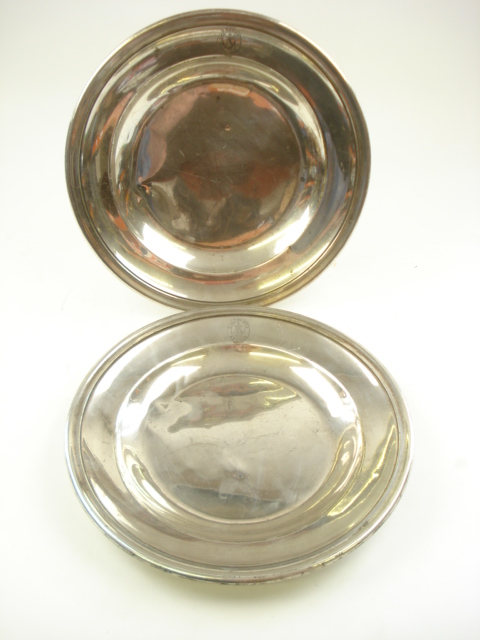 A pair of circular silver plated serving dishes for the French shipping company Chargeurs Reunis by