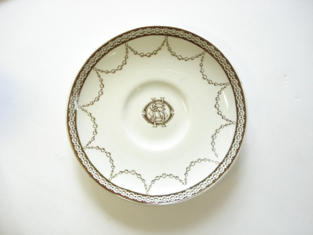 A White Star Line brown transfer saucer by Stonier & Co Ltd, Liverpool:, with monogram to centre,