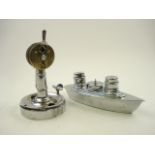 A nickel plated cigar cutter with everlasting match in the form of a ship's telegraph,