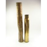 A salvaged 50 calibre shell case together with a 4 inch shell case in similar condition:,