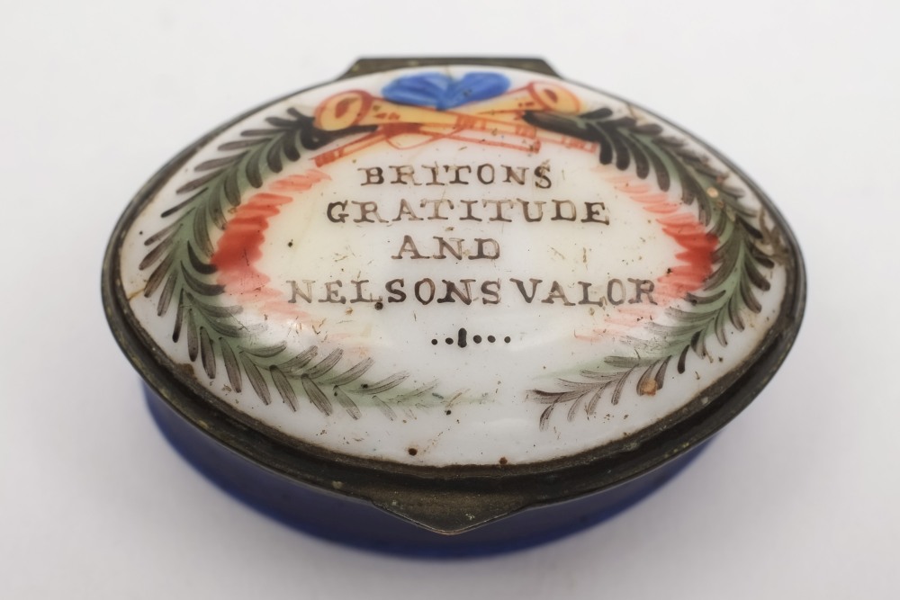 An early 19th century oval patch box 'Britons Gratitude and Nelsons Valor':,