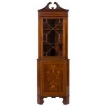 An Edwardian mahogany and marquetry standing corner display cabinet:,