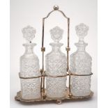 A silver plated three-division decanter stand by Walker & Hall: of rectangular outline,