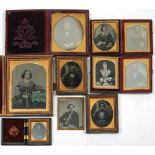 A collection of ten mid Victorian ambrotypes and daguerreotypes: mostly half length portraits of