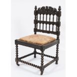 A 19th Century Indo Colonial carved ebonised side chair:,